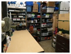 (Image: Shipping and Receiving with
 a Bench at Left and Pallet Racking to the Right)