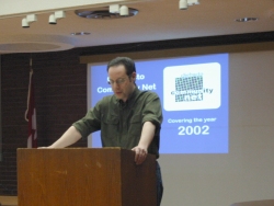 [Photo: Internal Committee Chair Mark Alberstat at AGM 2002]  