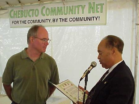 MP Gordon Earle gives certificate to Board Chair