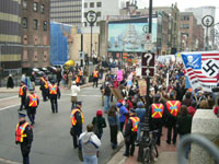 [Photo: Police and protesters.]  