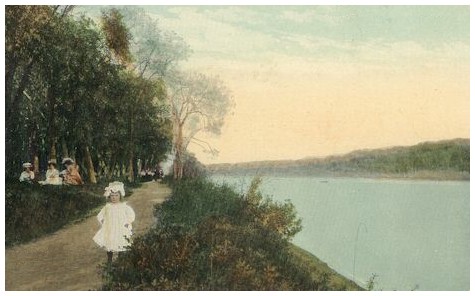 (Image: A Young Girl Poses on an Unpaved Park Walkway)