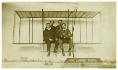 (Image: Four Men pose on an Airplane Set)