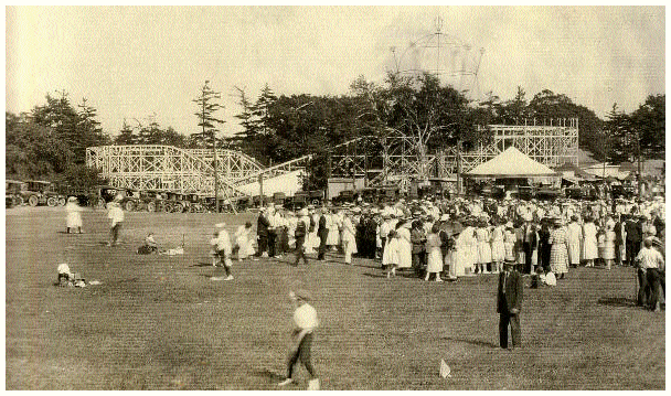 (Image: Midway Showing a `Figure 8' Coaster and Other Rides)