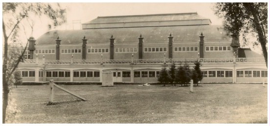 (Image: Lone Sunbathers Lie on the Grass Outside the Dance Pavilion)