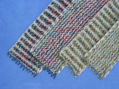 photo of scarves with beaded border.