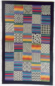 A colourful wallhanging or cushion cover based on traditional African textiles. 