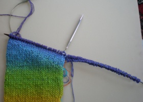 Needle A knitted across the first side of the sleeve
