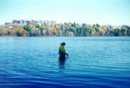 Biologist, Monica Gaertner, studying the substrate at Russell Lake in Fall of 1998