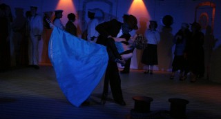 (Image: Two Characters Dance During a Shipboard Event)