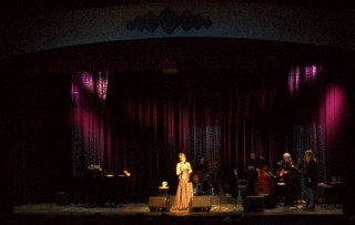(Image: Margot Sampson with the Band on Stage)