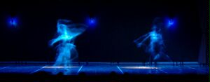 (Image: Dancers Move in a Blue Blur)