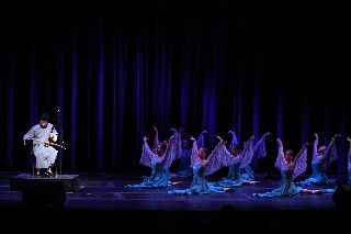 (Image: A Traditional Chinese Musician Accompanies a Group of
  Dancers)