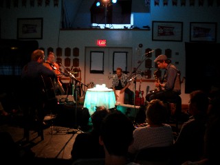 (Image: Four Songwriters Perform on a Circular Stage at Banook
  Boat Club)