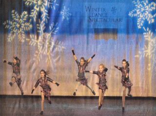 (Image: Dancers Leap in front of
  `Snowflake' Projections)