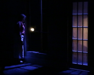 (Image: Late at Night, a Car Headlight is Seen in a Driveway 
 as a Woman Listens at an Open Window)